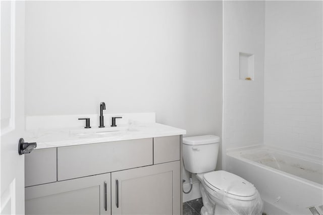 bathroom featuring vanity, walk in shower, and toilet