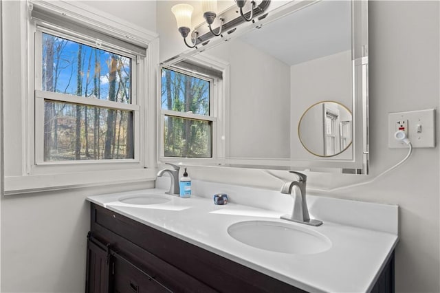 bathroom featuring double vanity and a sink