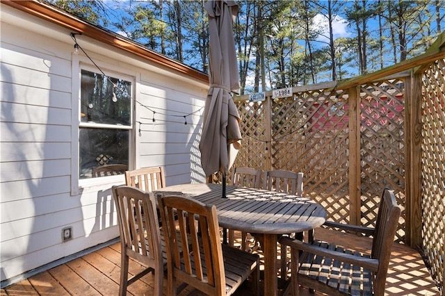 wooden deck with outdoor dining space