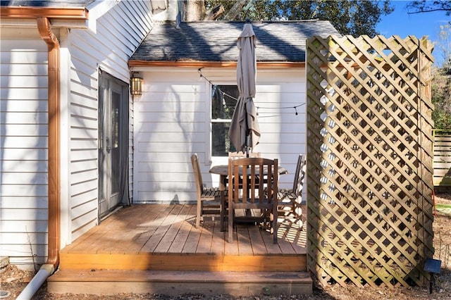 wooden terrace featuring outdoor dining area