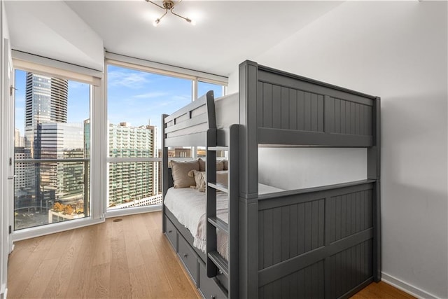 3325 Piedmont Rd NE Unit 2407, Atlanta, GA 30305 - bedroom featuring light wood-style floors and a city view