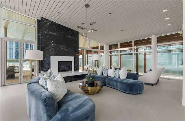 3325 Piedmont Rd NE Unit 2407, Atlanta, GA 30305 - living area featuring tile patterned flooring, floor to ceiling windows, and a healthy amount of sunlight