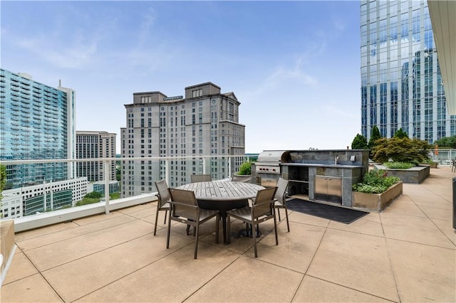 3325 Piedmont Rd NE Unit 2407, Atlanta, GA 30305 - view of patio with a view of city, outdoor dining space, and a grill