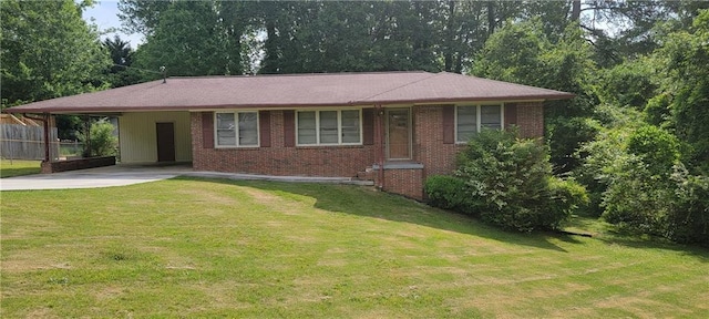ranch-style home with brick siding, a front yard, driveway, and an attached carport