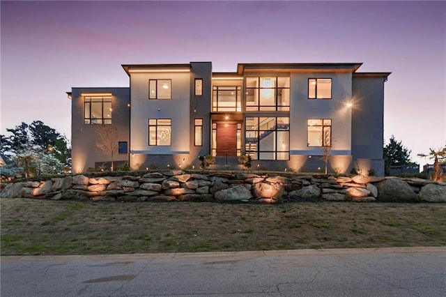 contemporary house featuring stucco siding