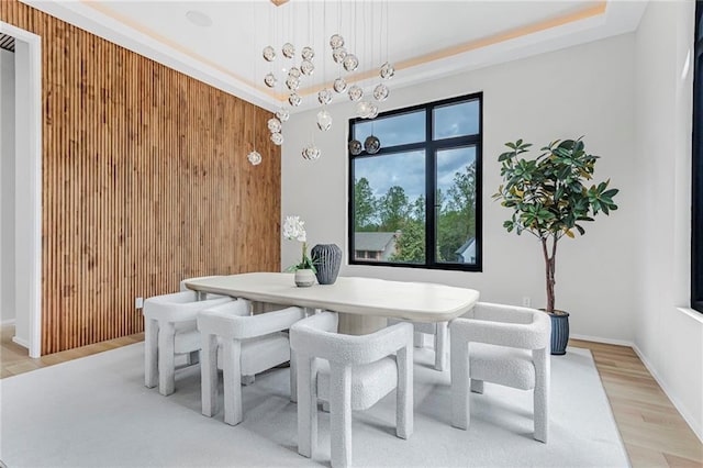 dining room featuring baseboards and wood finished floors