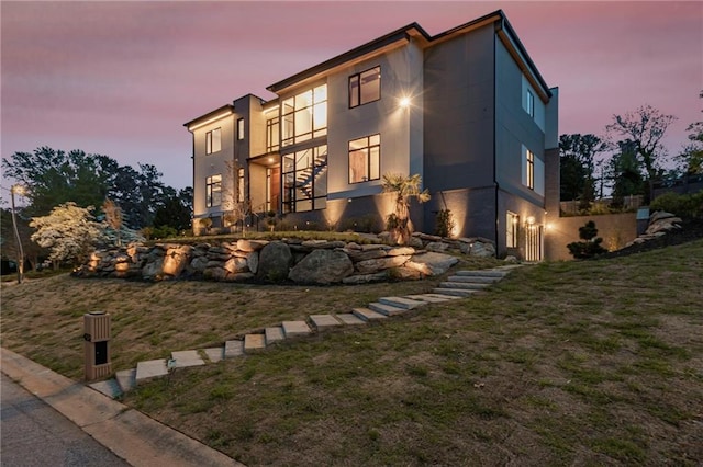 exterior space with a yard and stucco siding