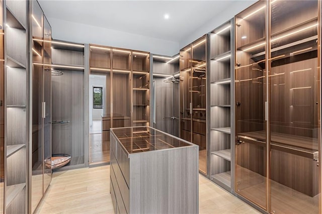 walk in closet featuring light wood-type flooring