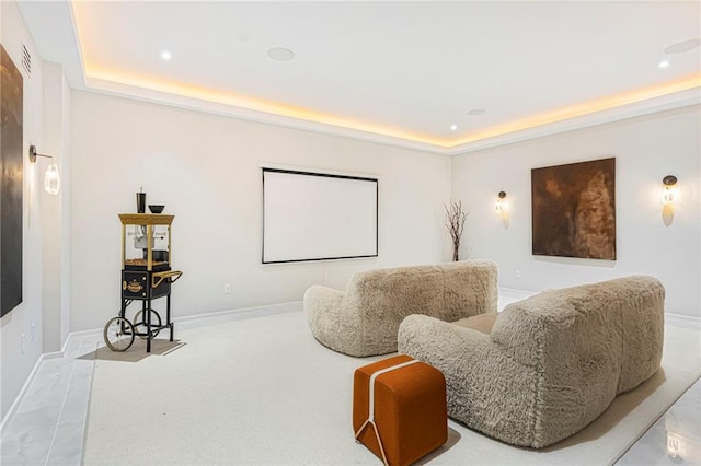 cinema with recessed lighting, a tray ceiling, and baseboards