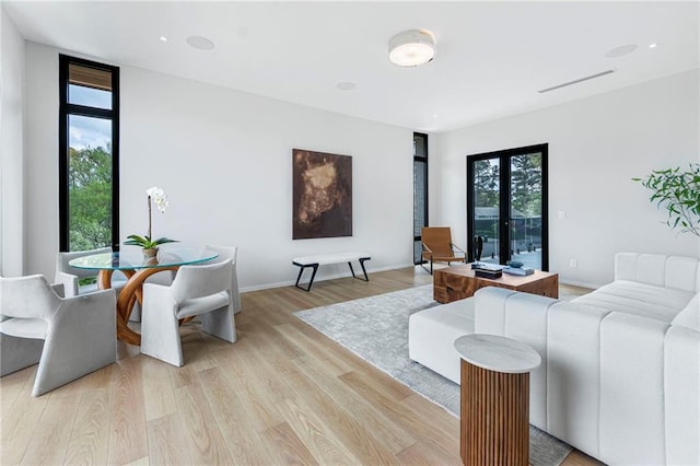 living room with light wood finished floors and baseboards