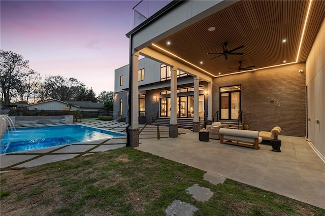 view of pool featuring entry steps, ceiling fan, a fenced in pool, and a patio