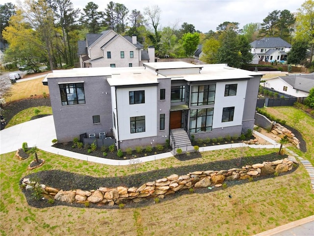 view of front of property featuring stucco siding and fence