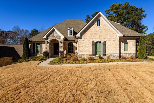 view of front of home with a front lawn