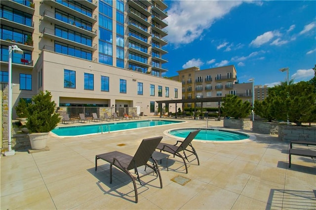 pool featuring a patio and a community hot tub