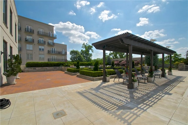 view of home's community with a patio area and a pergola