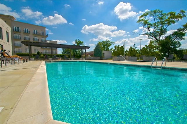 community pool with a patio area