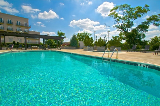 community pool featuring a patio area