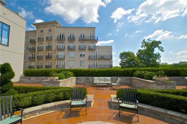 view of home's community featuring outdoor lounge area and a patio