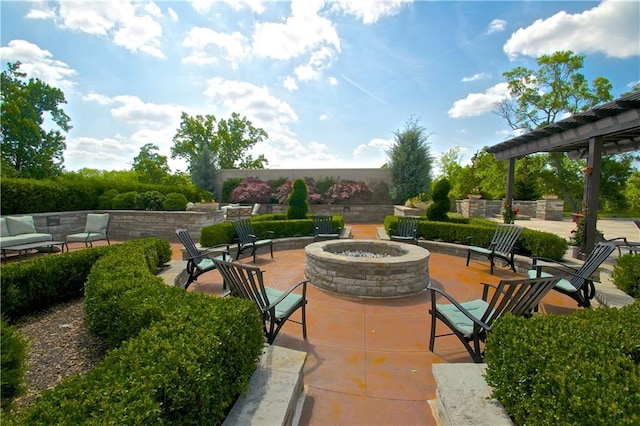 view of patio / terrace featuring an outdoor fire pit