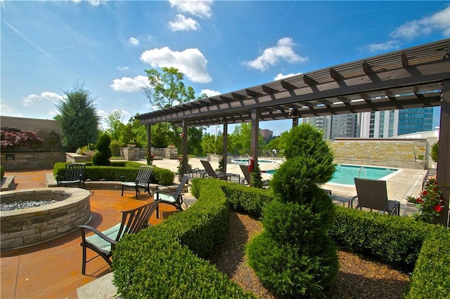 view of patio / terrace featuring a community pool, an outdoor fire pit, and a pergola