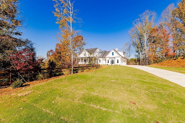 view of front of home with a front lawn and driveway