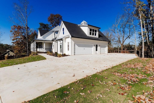 view of property exterior with concrete driveway and an attached garage