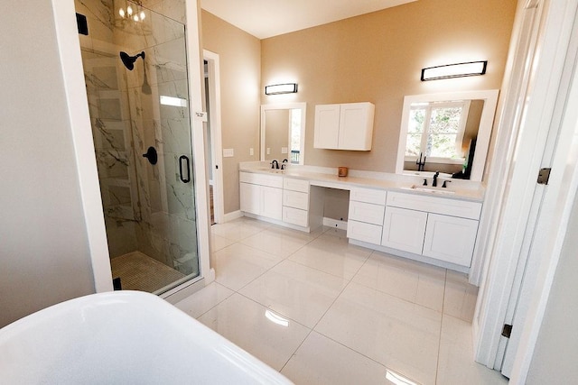 full bathroom featuring a marble finish shower, a sink, a freestanding tub, and double vanity