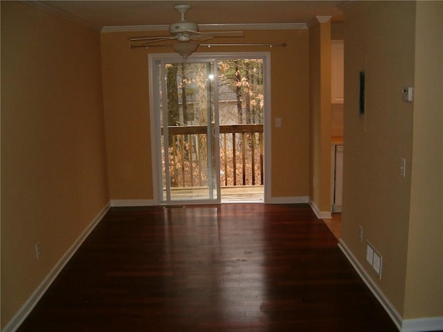 unfurnished room with ceiling fan, dark hardwood / wood-style floors, and ornamental molding