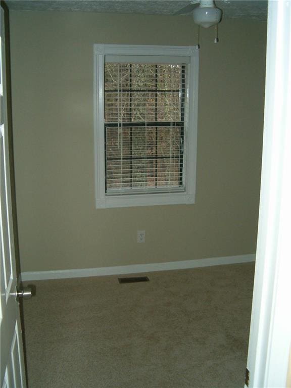 unfurnished room with carpet