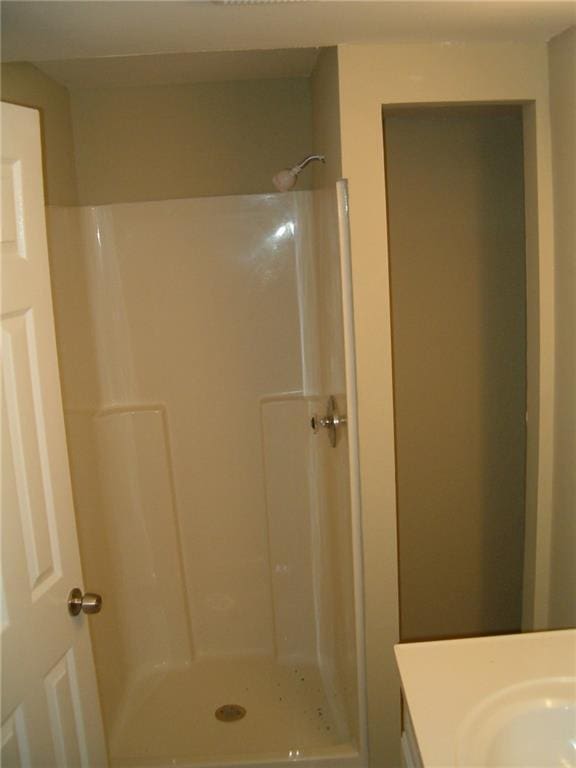 bathroom featuring walk in shower