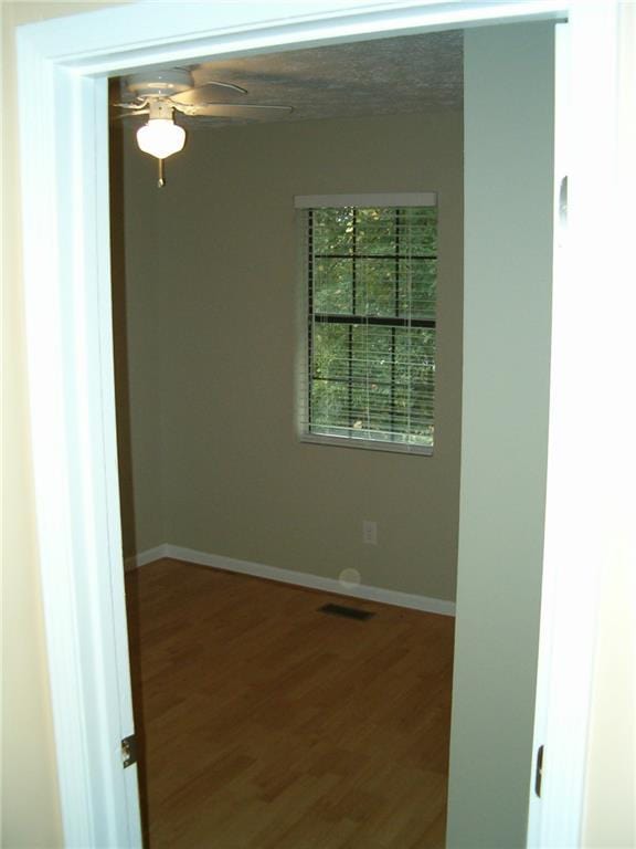 empty room featuring hardwood / wood-style floors