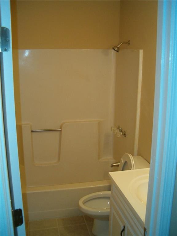 full bathroom featuring bathtub / shower combination, tile patterned floors, vanity, and toilet