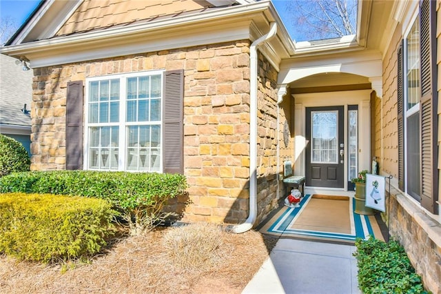 view of exterior entry featuring stone siding