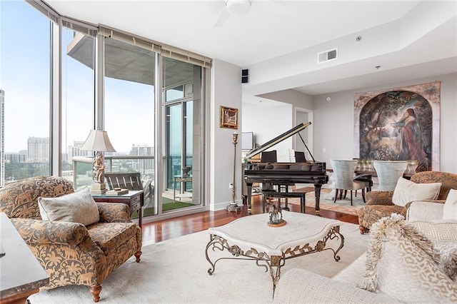 2795 Peachtree Rd NE Unit 2101, Atlanta, GA 30305 - living area featuring expansive windows, wood finished floors, and a ceiling fan