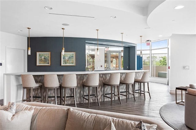 2795 Peachtree Rd NE Unit 2101, Atlanta, GA 30305 - bar featuring wood finished floors, hanging light fixtures, baseboards, and recessed lighting
