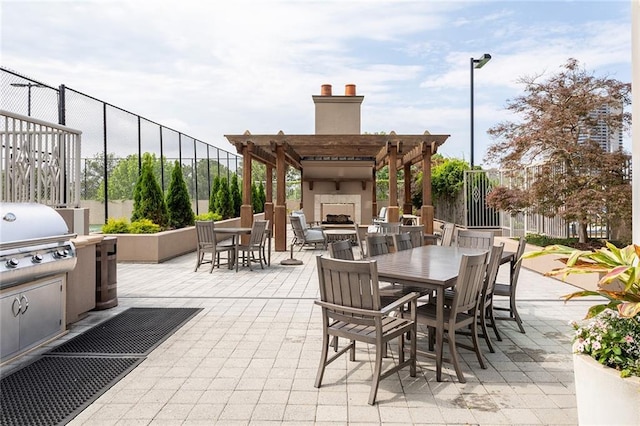 2795 Peachtree Rd NE Unit 2101, Atlanta, GA 30305 - view of patio featuring exterior fireplace, a grill, a pergola, and outdoor dining area