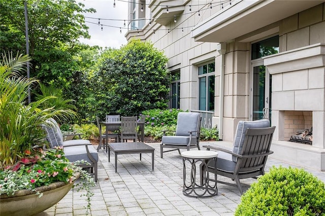 2795 Peachtree Rd NE Unit 2101, Atlanta, GA 30305 - view of patio featuring an outdoor fireplace