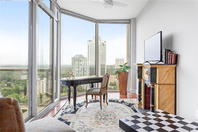 2795 Peachtree Rd NE Unit 2101, Atlanta, GA 30305 - home office with floor to ceiling windows, healthy amount of natural light, wood finished floors, and a ceiling fan