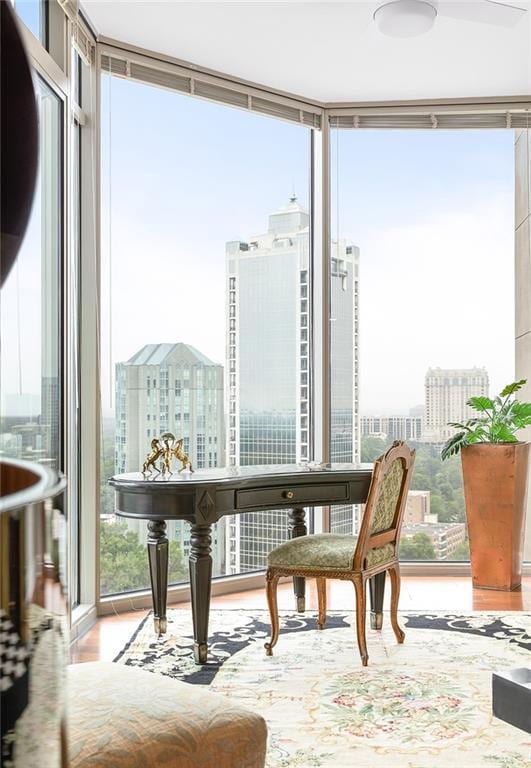 2795 Peachtree Rd NE Unit 2101, Atlanta, GA 30305 - sitting room featuring expansive windows, healthy amount of natural light, a view of city, and wood finished floors