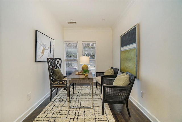 sitting room featuring hardwood / wood-style flooring and crown molding