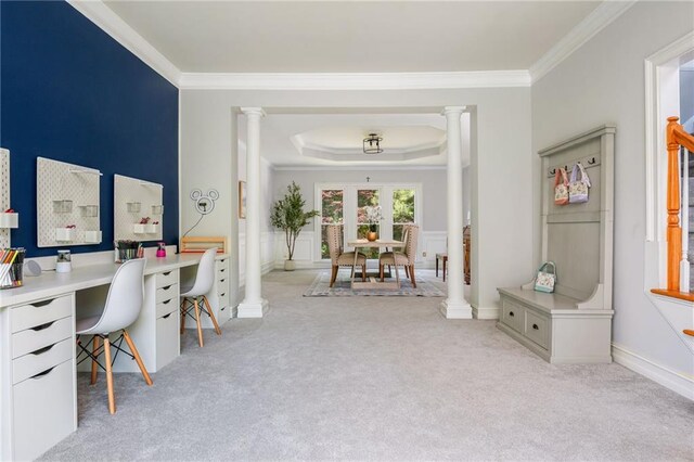 home office with crown molding, ornate columns, and light colored carpet