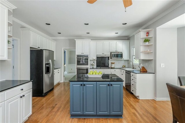 kitchen featuring dark countertops, appliances with stainless steel finishes, and open shelves