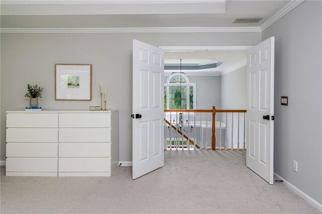 interior space with crown molding, baseboards, carpet, and visible vents