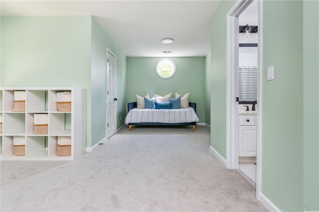 bedroom featuring baseboards and carpet flooring