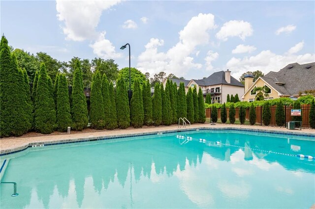 pool featuring fence