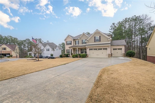 craftsman-style home with a front lawn and a garage