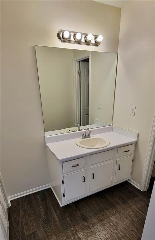 849 Cadet Ct NW, Lilburn, GA 30047 - unfurnished room featuring dark colored carpet, visible vents, and baseboards