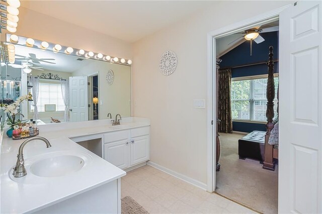 bathroom featuring vanity and vaulted ceiling