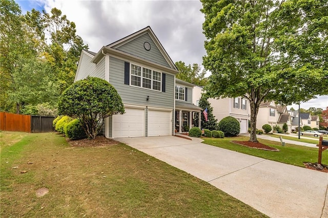 view of front of property with a garage and a front lawn