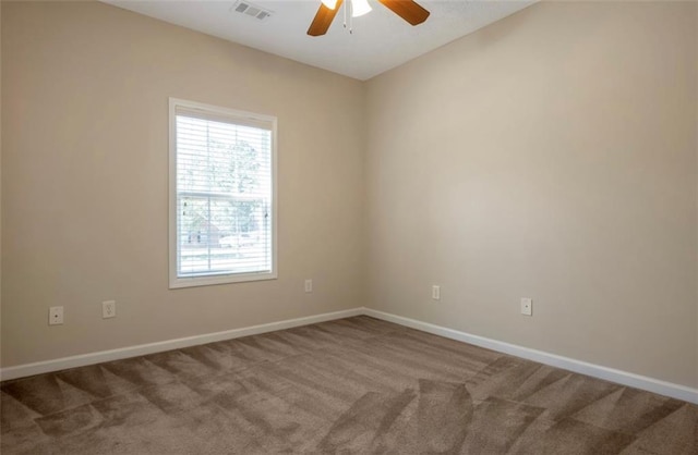 empty room featuring ceiling fan and carpet floors